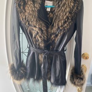 CACHE leather coat and second coat with fur .